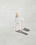 Pro Kiss'r Lip-Loving Scrubstick standing upright with the cap off and the lip scrub twisted up.