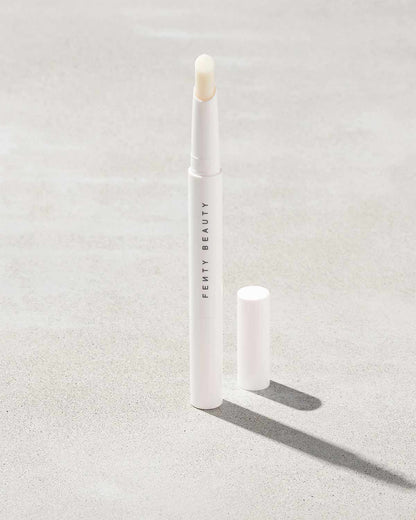 Brow MVP Sculpting Wax Pencil standing upright with the cap off and the brow wax twisted up.