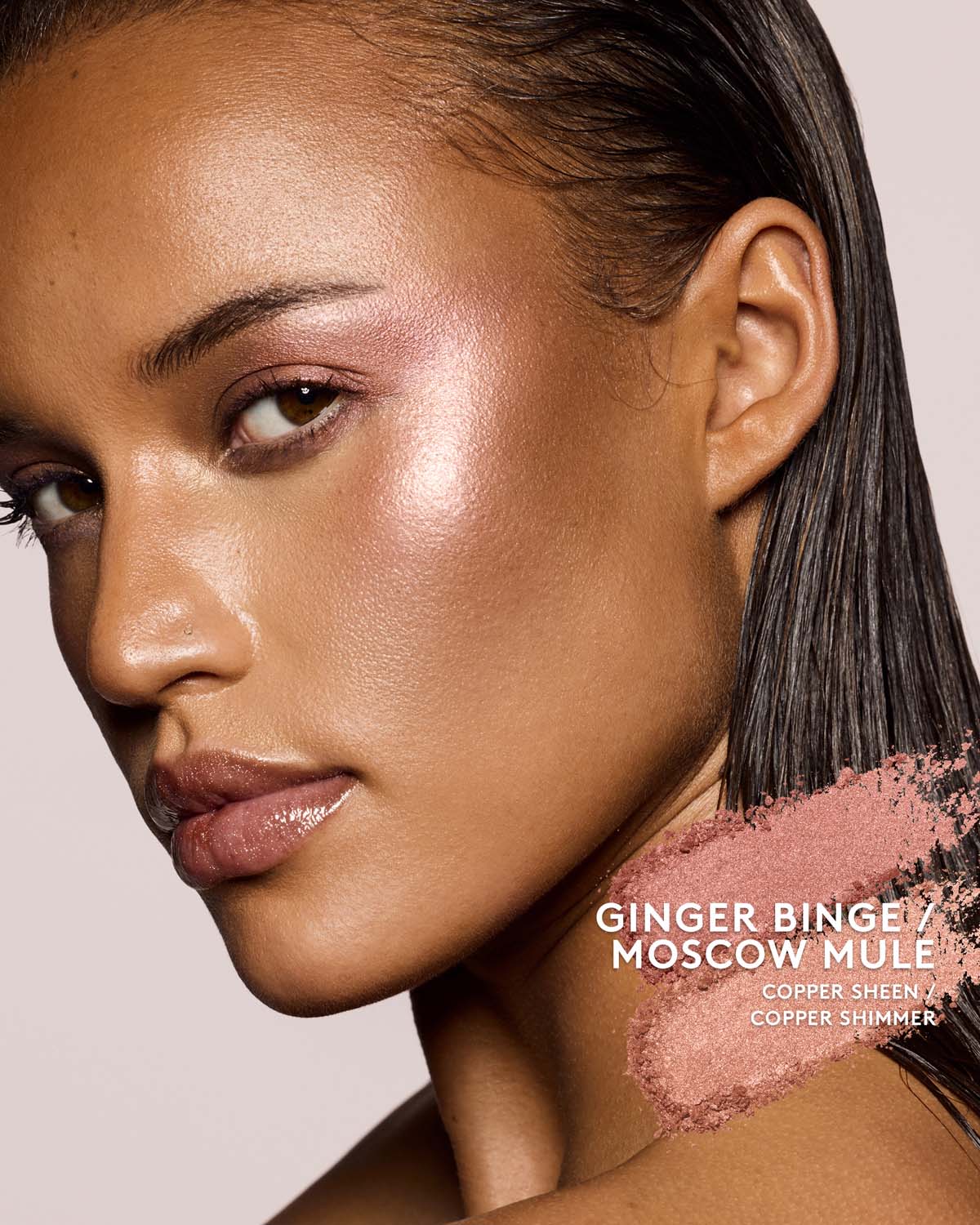medium skin toned model wearing killawatt freestyle highlighter in ginger binge / moscow mule