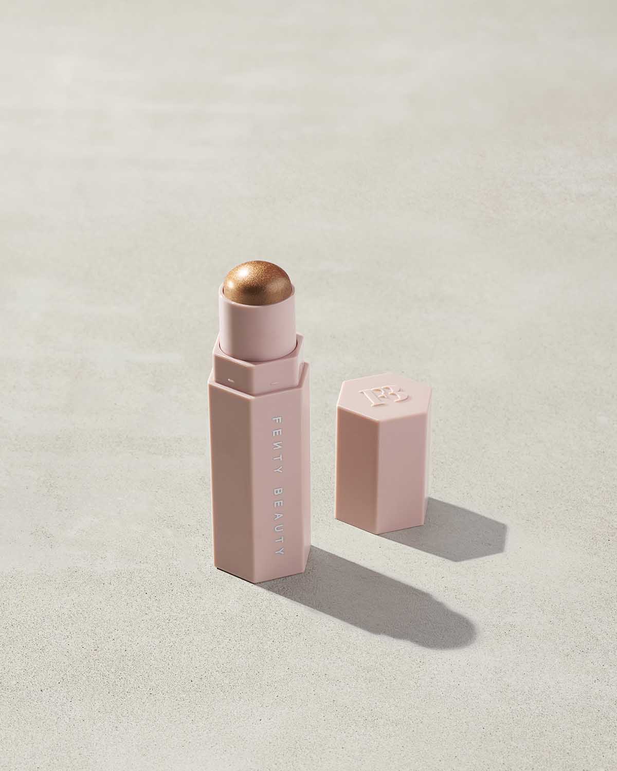 Match Stix Shimmer Skinstick shown in shade Crown’d on a concrete background.